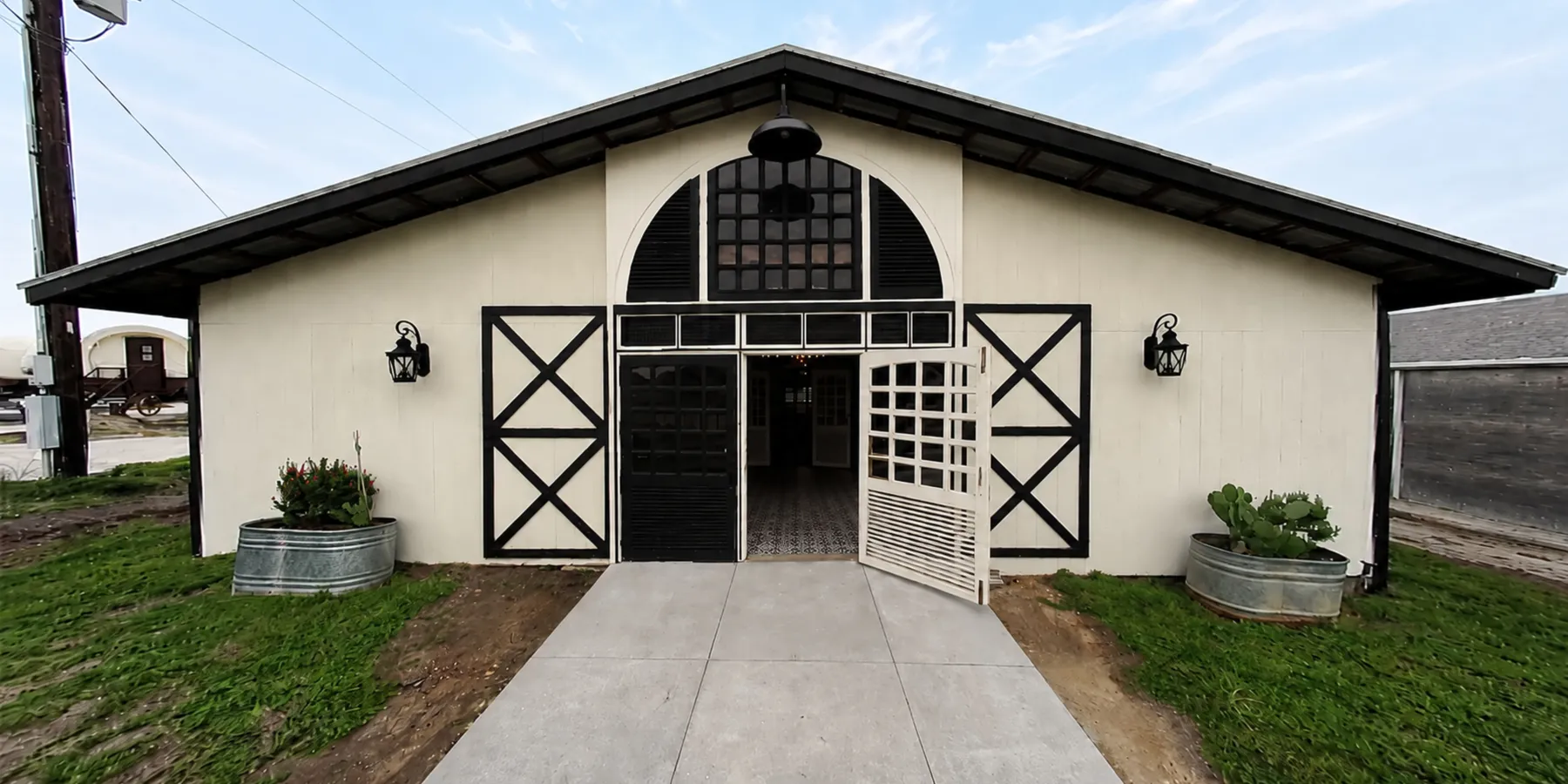 The cream and black dance hall barn