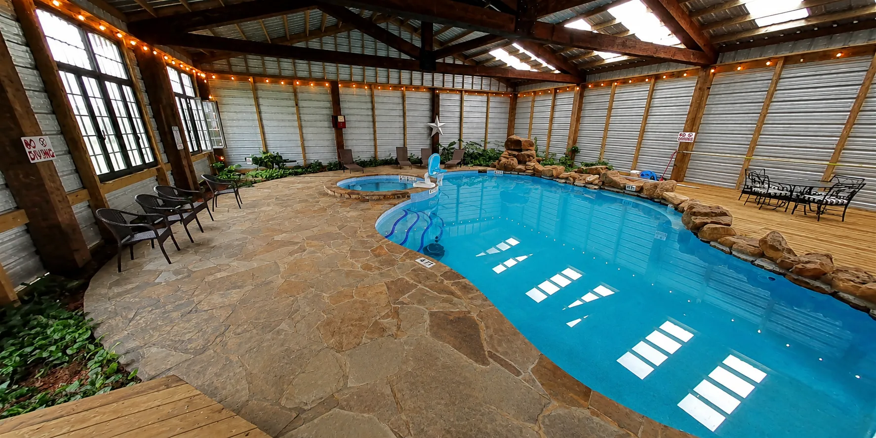The indoor pool with its rock waterfall